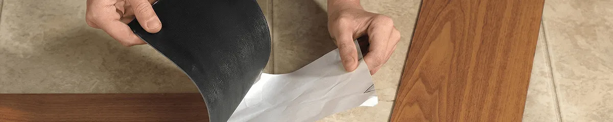 A professional installing vinyl flooring in Albuquerque, NM